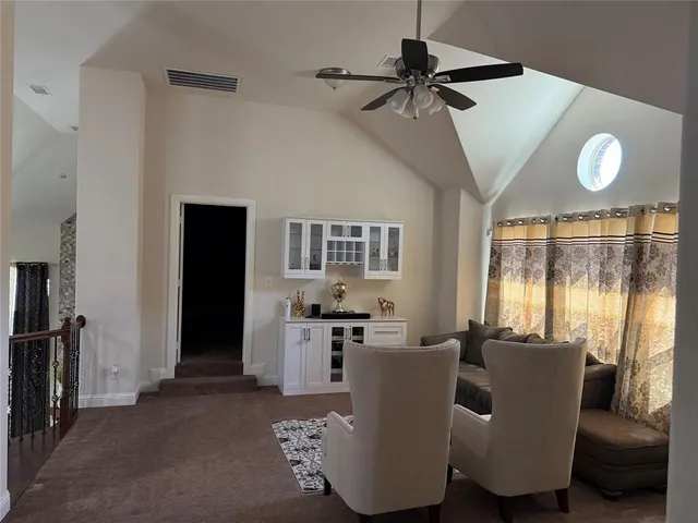 a living room with furniture and a window