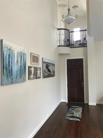 a view of livingroom with furniture and chandelier fan