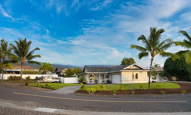 a view of multiple houses with a street
