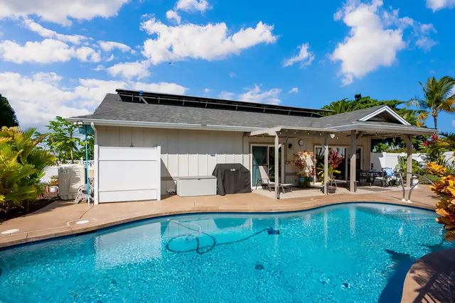 a view of a patio with dining table and chairs with a barbeque grill and couches