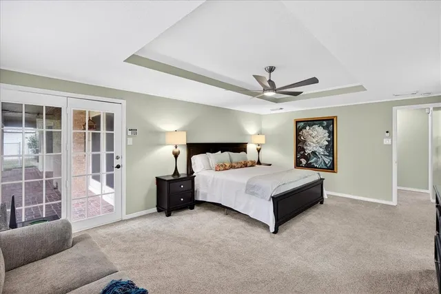 a spacious bedroom with a bed and window