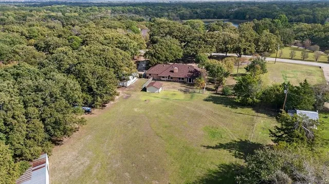 an aerial view of residential house with outdoor space