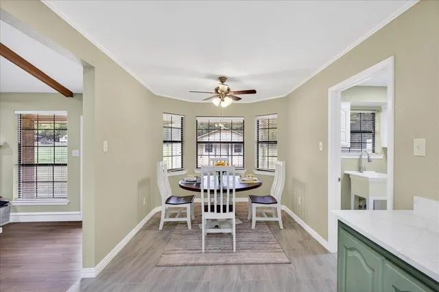 a dining room with furniture and window