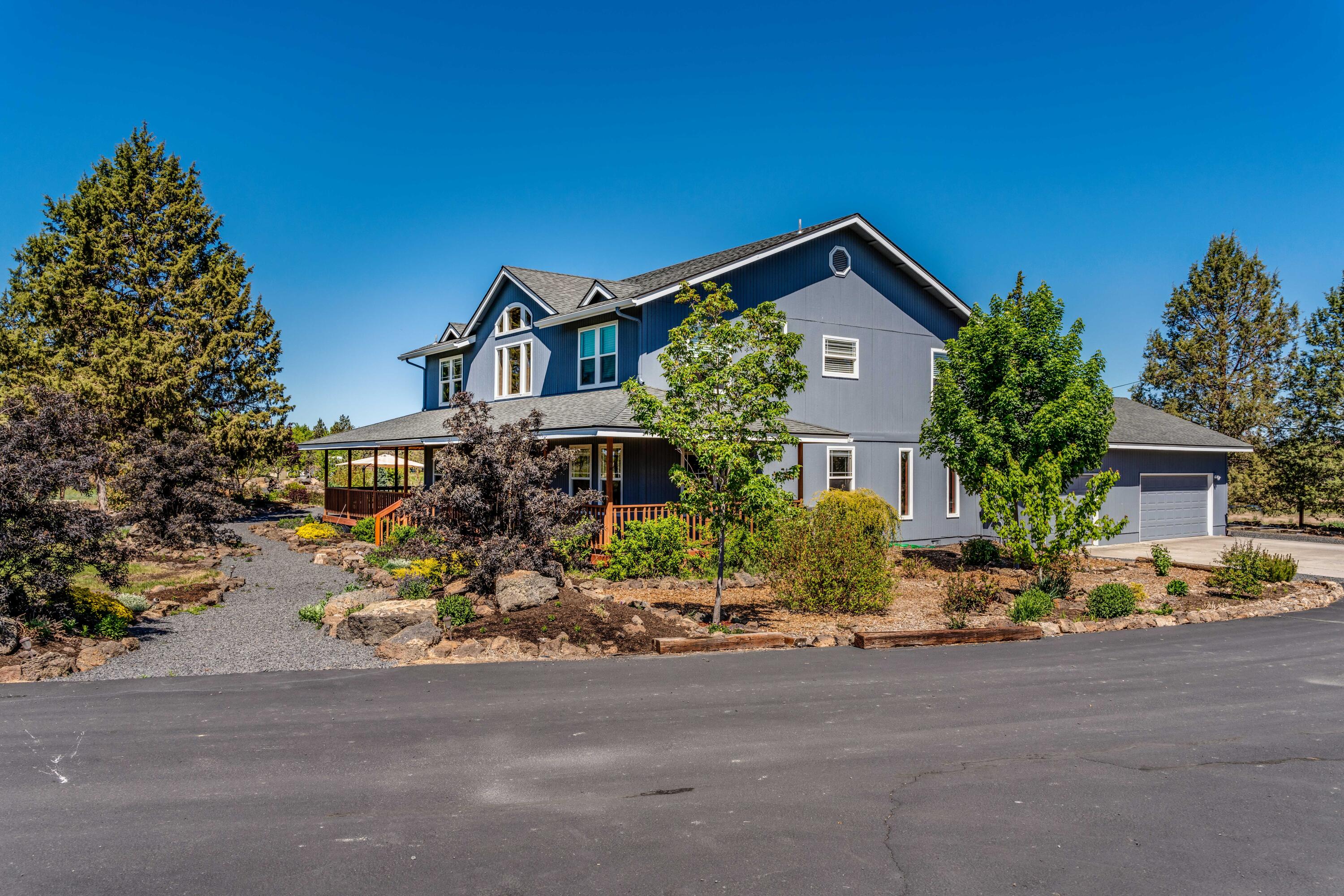 22234 Nelson Road Bend, OR 97701 - Photo 47 of 60 front view of a house with a street