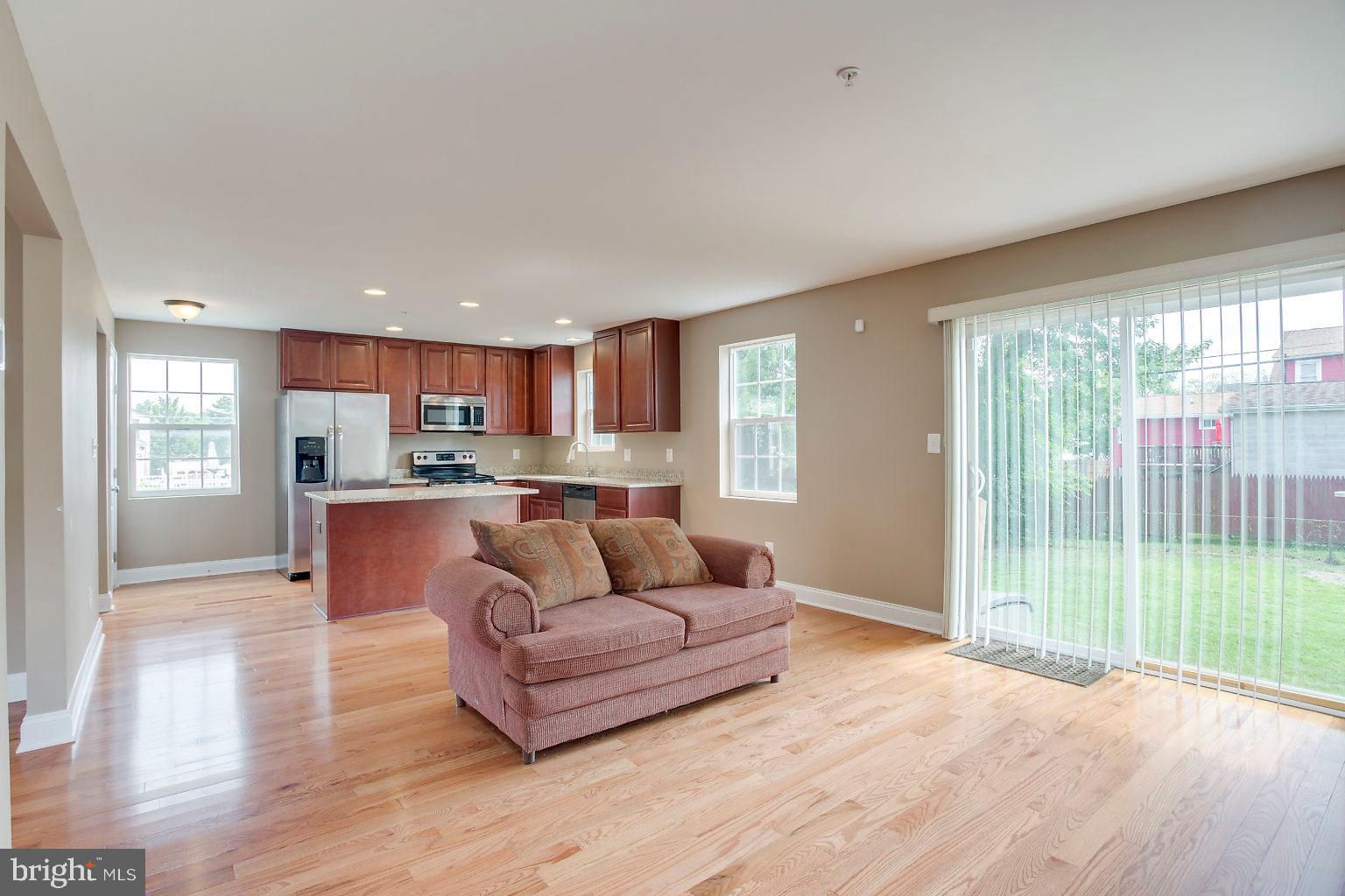 2815 Virginia Avenue Halethorpe, MD 21227 - Photo 20 of 44 Family room with sliding glass doors to yard