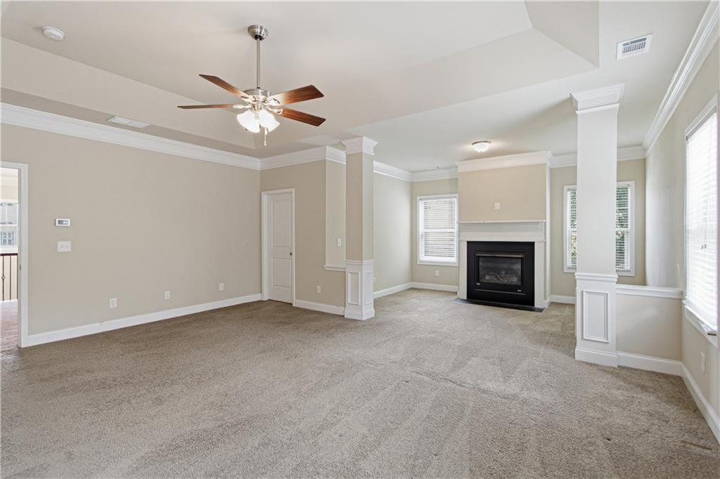 114 Madison Street Canton, GA 30115 - Photo 12 of 39 an empty room with fireplace fan and windows