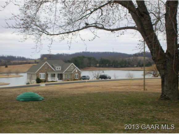 531 Steeles Fort Road Raphine, VA 24472 - Photo 14 of 16 a front view of a house with a yard and lake view