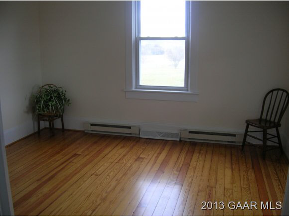 531 Steeles Fort Road Raphine, VA 24472 - Photo 7 of 16 a view of a room with wooden floor and a window