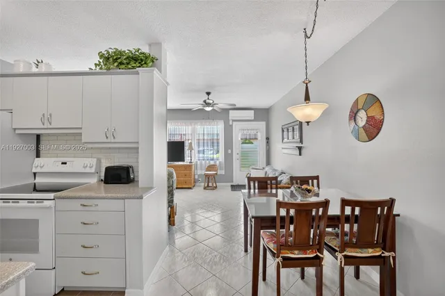 a view of a kitchen and dining area with furniture