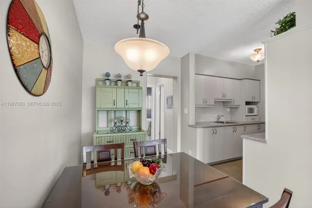 a very nice looking dining room with a table and chairs