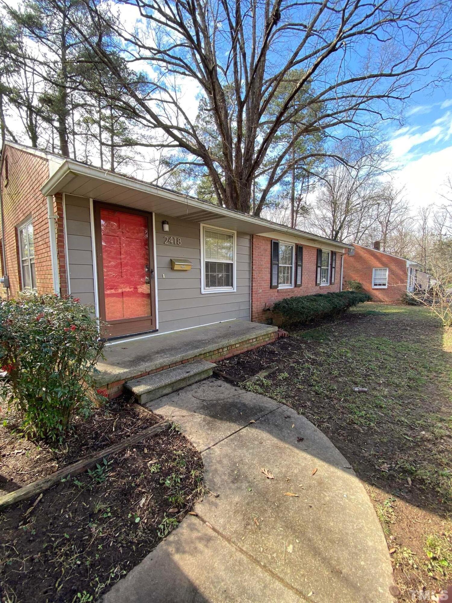 2418 Stevens Road Raleigh, NC 27610 - Photo 1 of 17 a front view of a house with garden