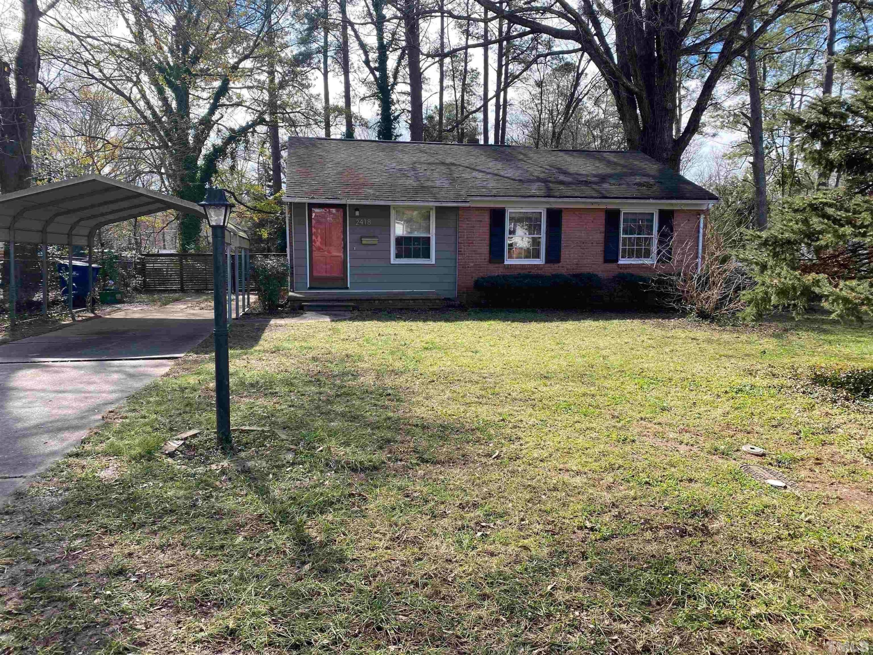 2418 Stevens Road Raleigh, NC 27610 - Photo 2 of 17 a brick house that has a tree in front of it