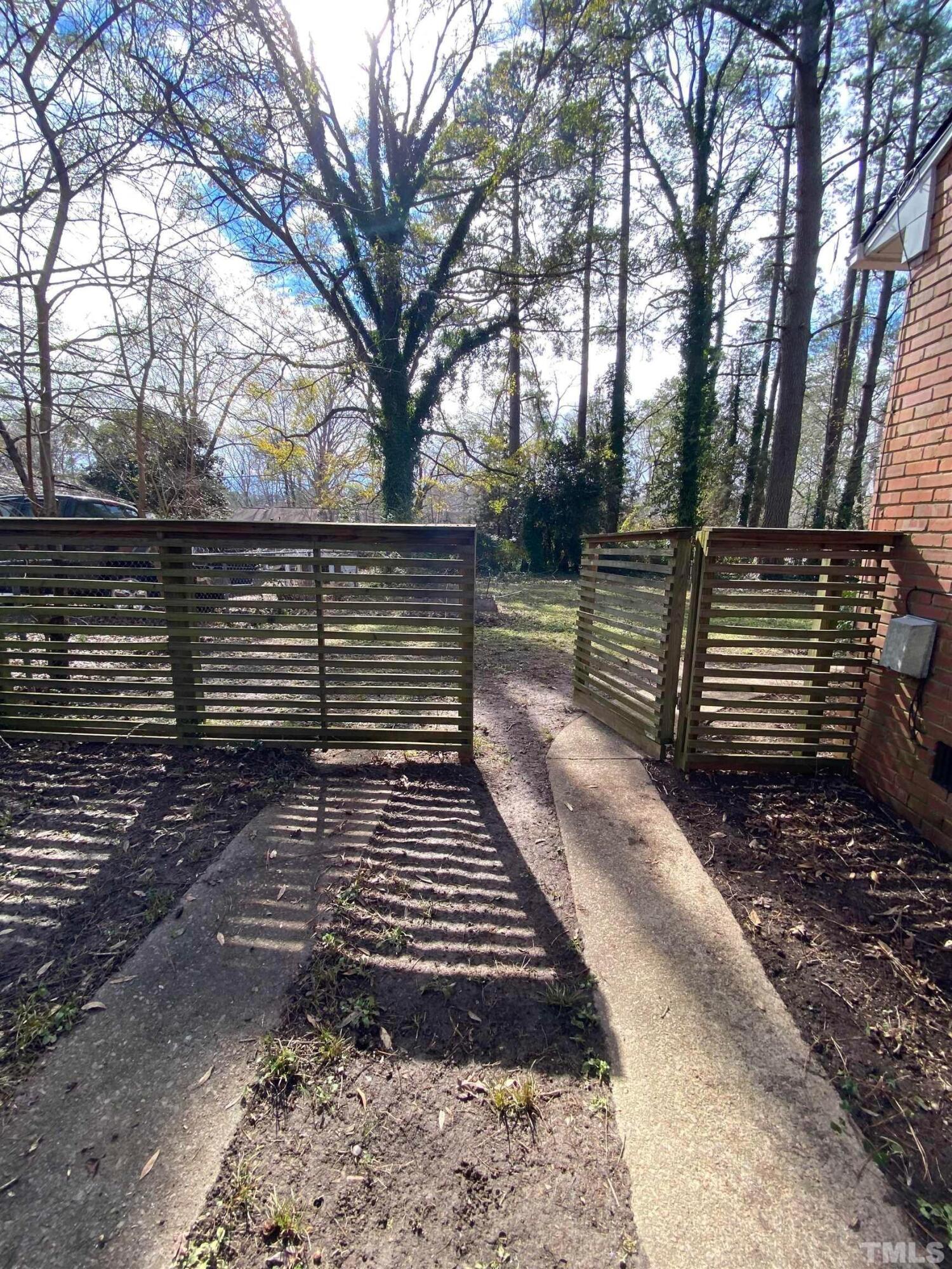 2418 Stevens Road Raleigh, NC 27610 - Photo 3 of 17 a view of a yard with trees