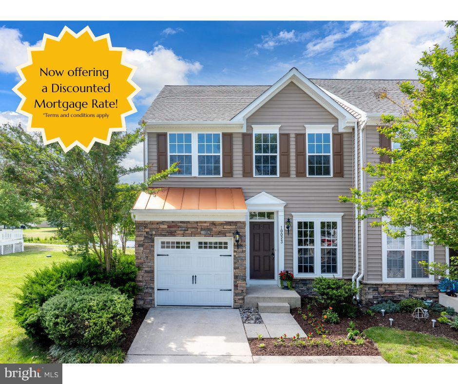 10023 Iron Pointe Drive Extension, Unit 201B2 Millsboro, DE 19966 - Photo 1 of 41 a front view of a house with a yard and garage