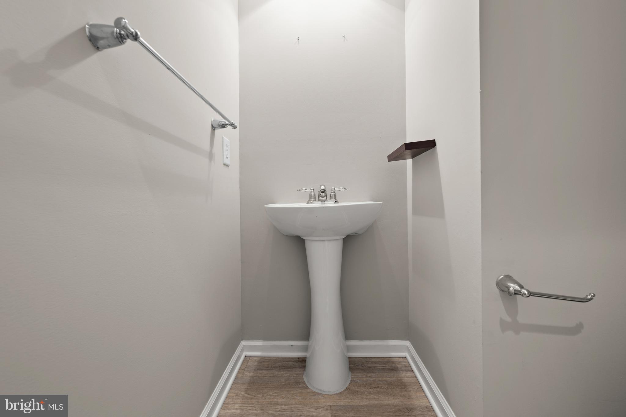 10023 Iron Pointe Drive Extension, Unit 201B2 Millsboro, DE 19966 - Photo 16 of 41 a bathroom with a sink