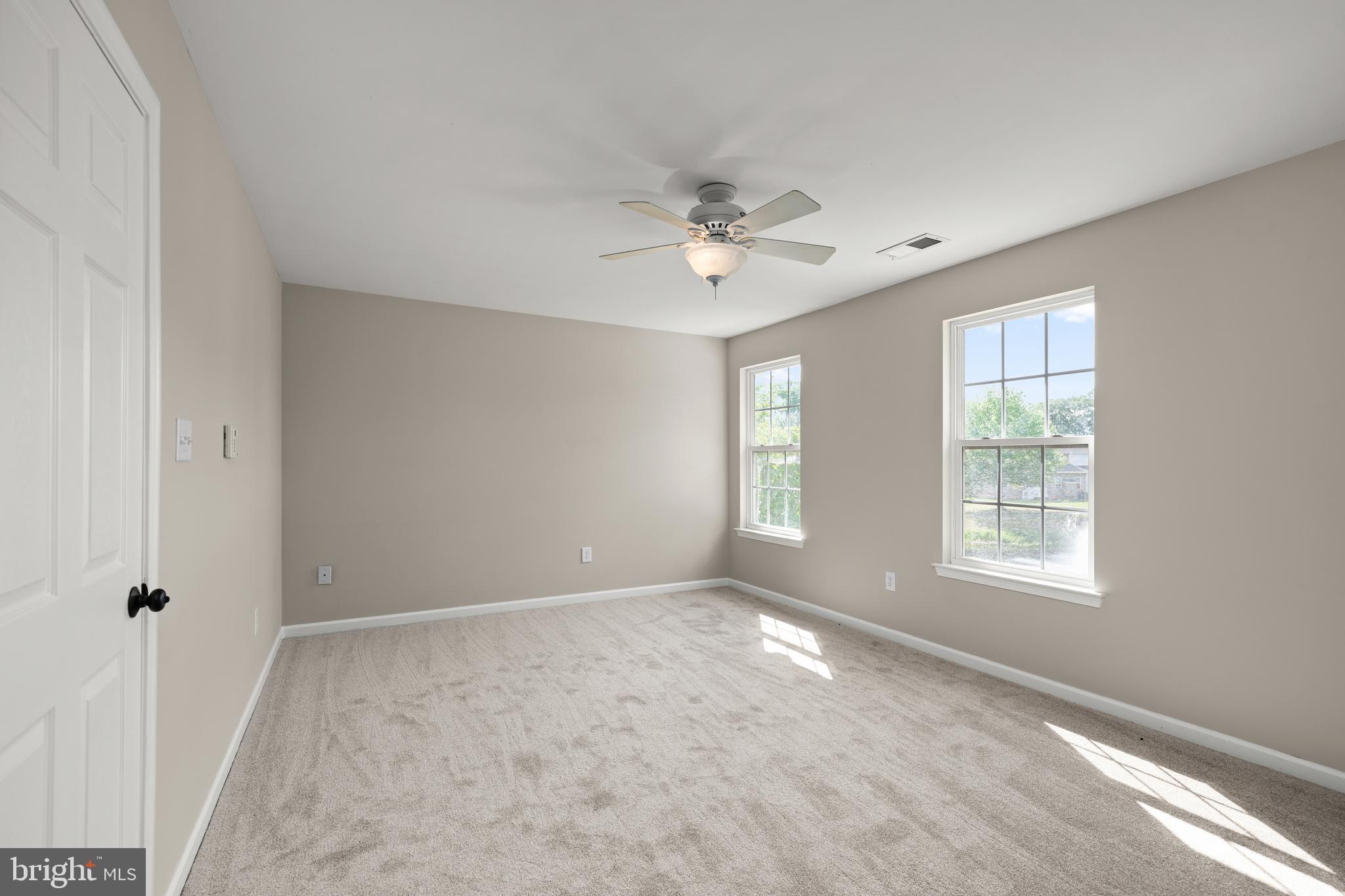 10023 Iron Pointe Drive Extension, Unit 201B2 Millsboro, DE 19966 - Photo 17 of 41 a view of an empty room with a window