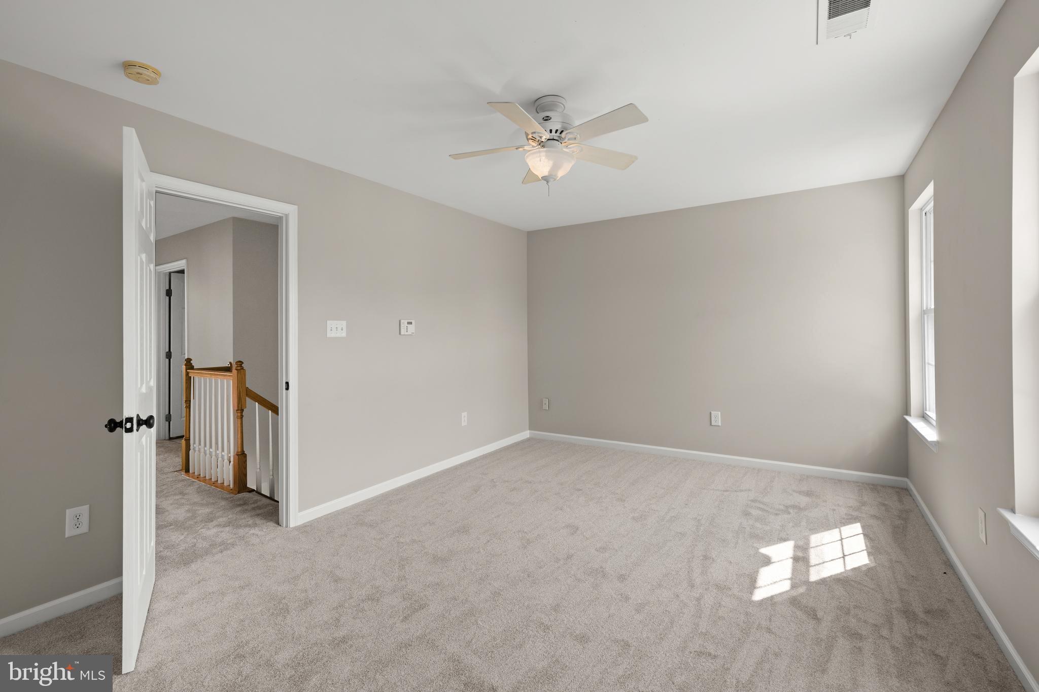 10023 Iron Pointe Drive Extension, Unit 201B2 Millsboro, DE 19966 - Photo 18 of 41 a view of a livingroom with a ceiling fan and window