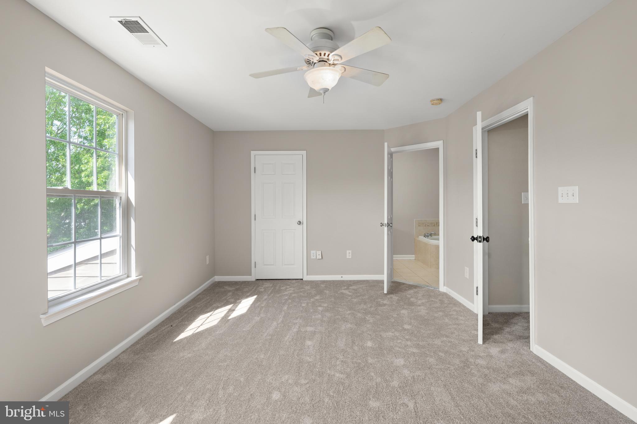 10023 Iron Pointe Drive Extension, Unit 201B2 Millsboro, DE 19966 - Photo 19 of 41 a view of an empty room with a window