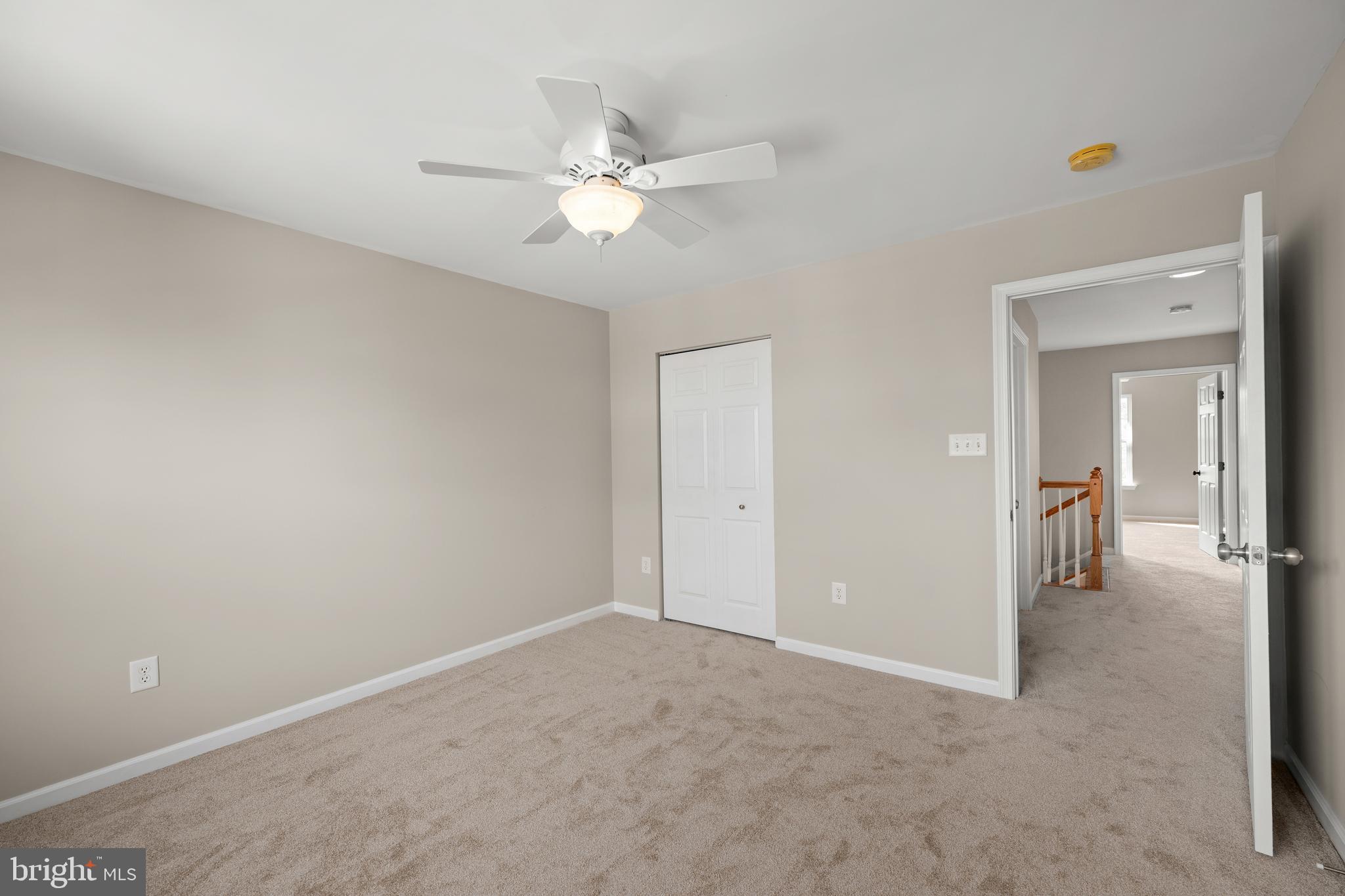 10023 Iron Pointe Drive Extension, Unit 201B2 Millsboro, DE 19966 - Photo 27 of 41 a view of a room with a fan and closet area