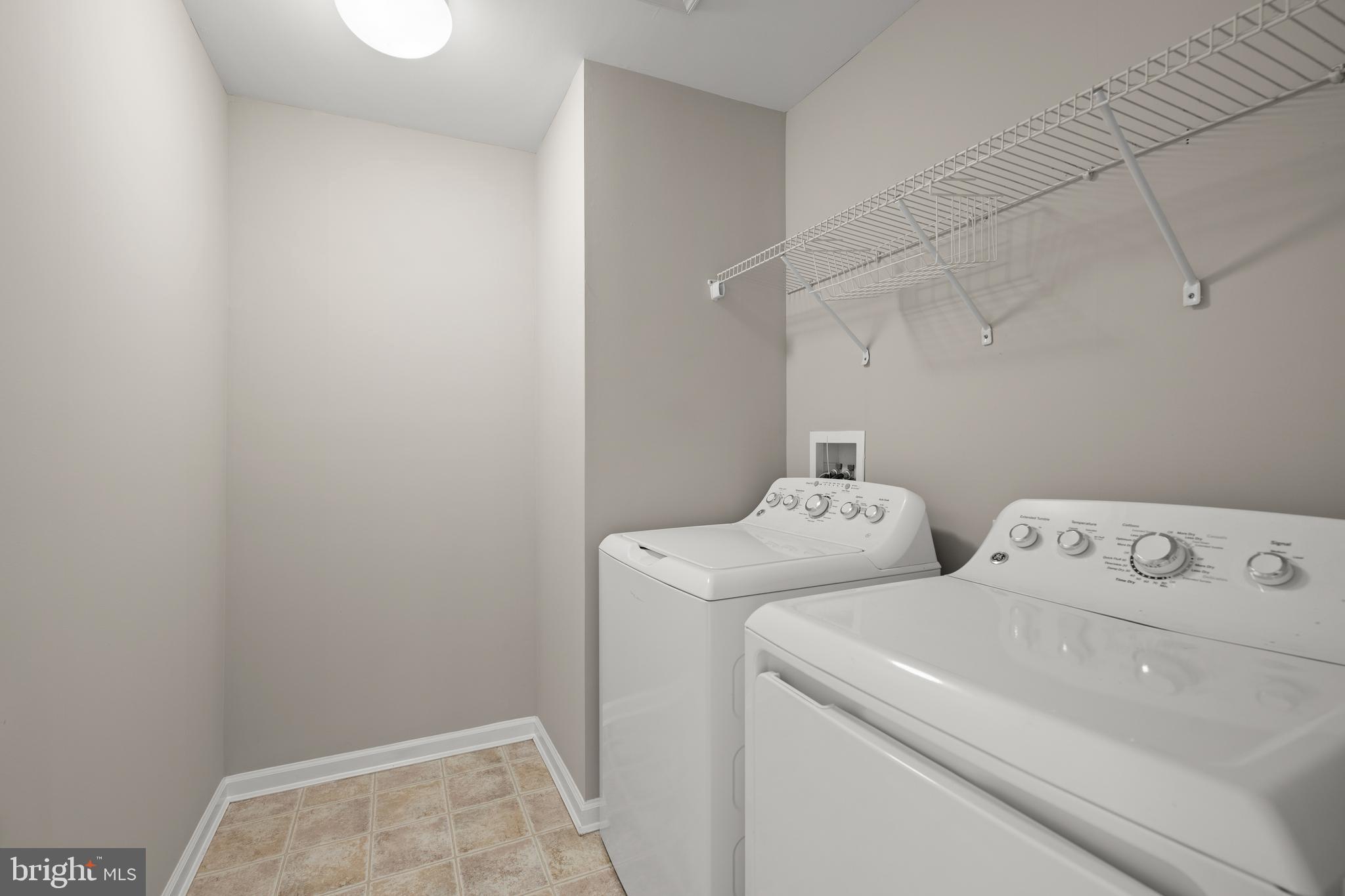 10023 Iron Pointe Drive Extension, Unit 201B2 Millsboro, DE 19966 - Photo 28 of 41 a utility room with dryer and washer