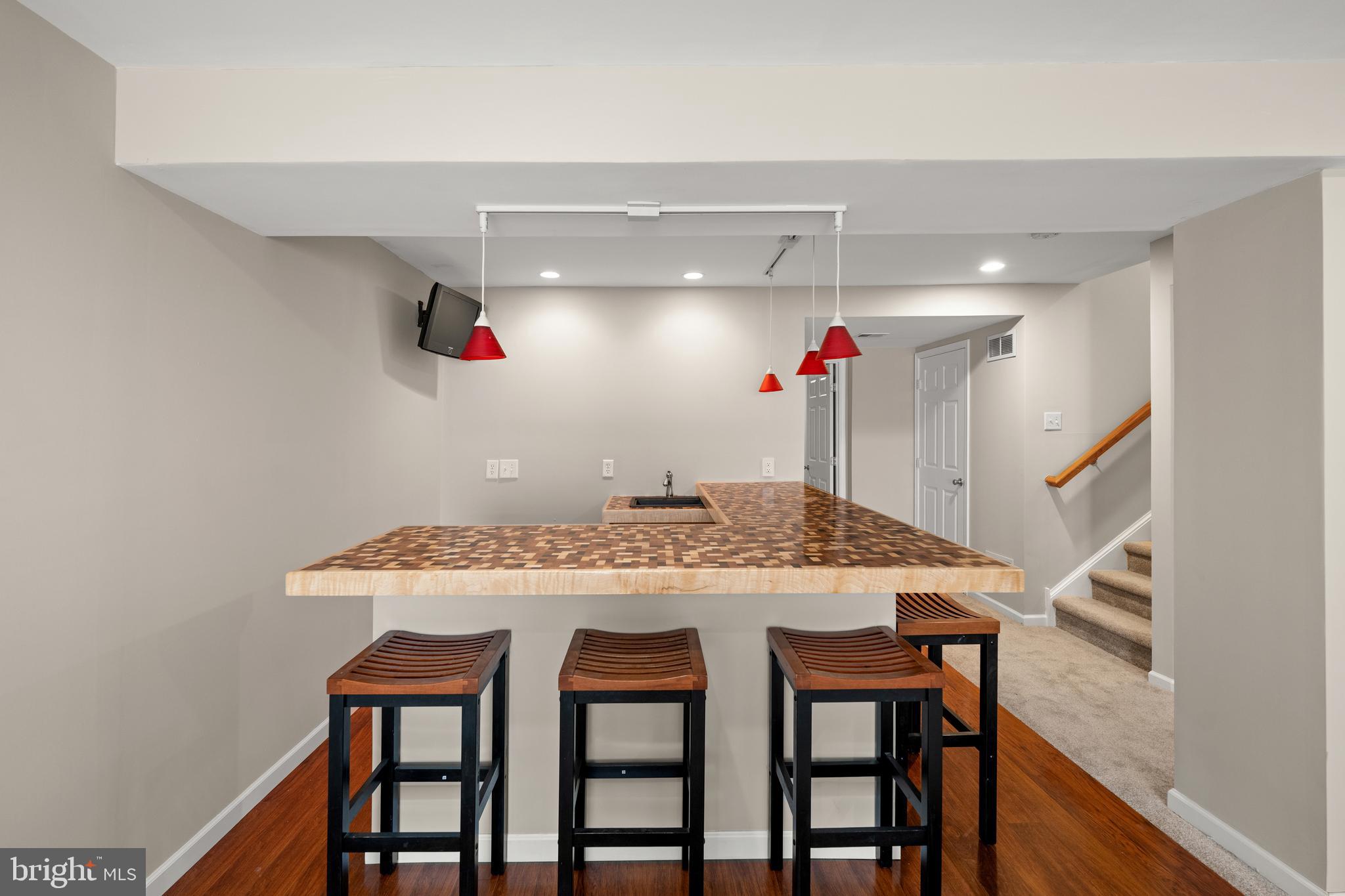 10023 Iron Pointe Drive Extension, Unit 201B2 Millsboro, DE 19966 - Photo 31 of 41 a view of a dining room with furniture and wooden floor