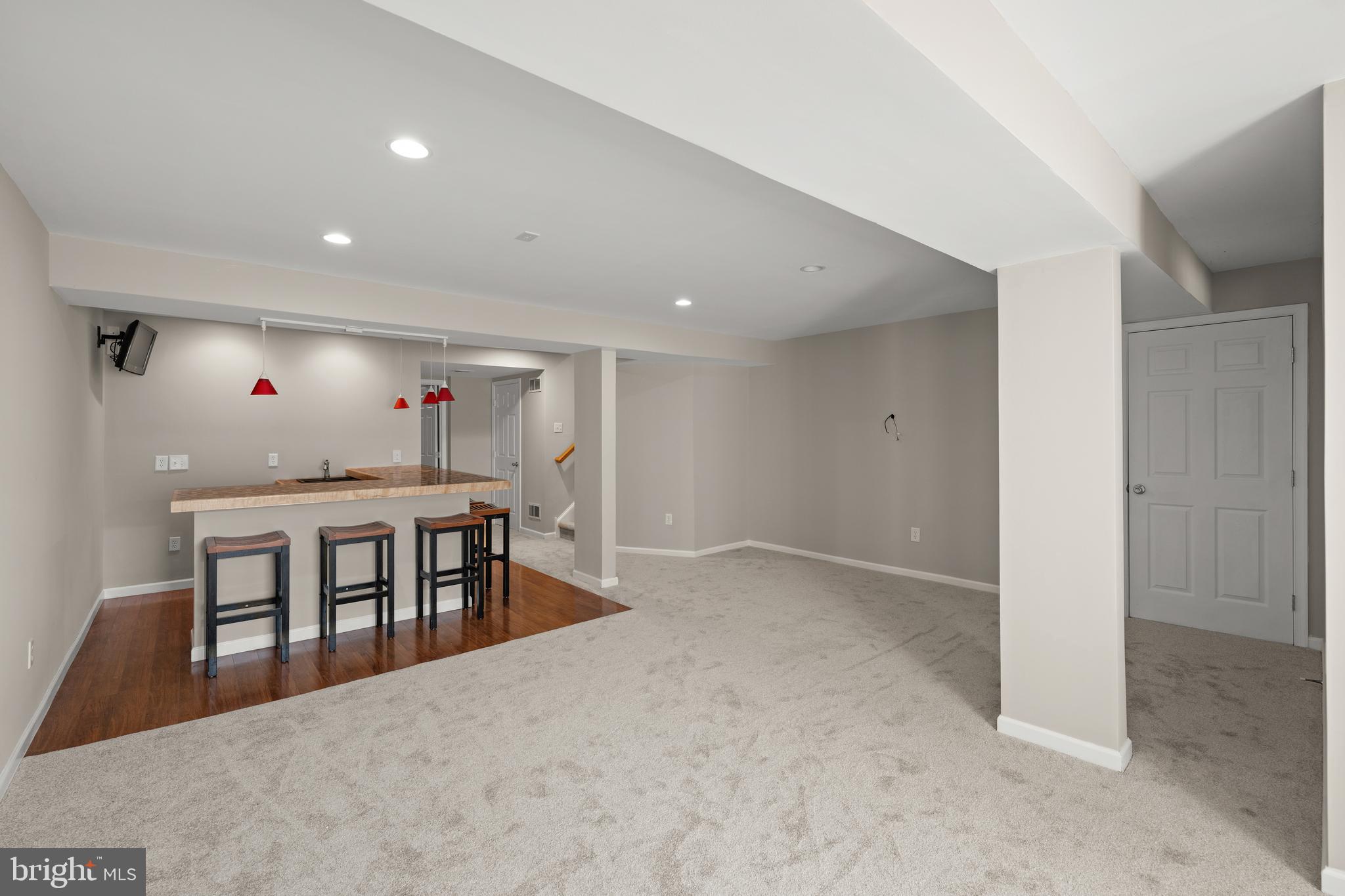 10023 Iron Pointe Drive Extension, Unit 201B2 Millsboro, DE 19966 - Photo 32 of 41 a dining room with furniture and a floor to ceiling window