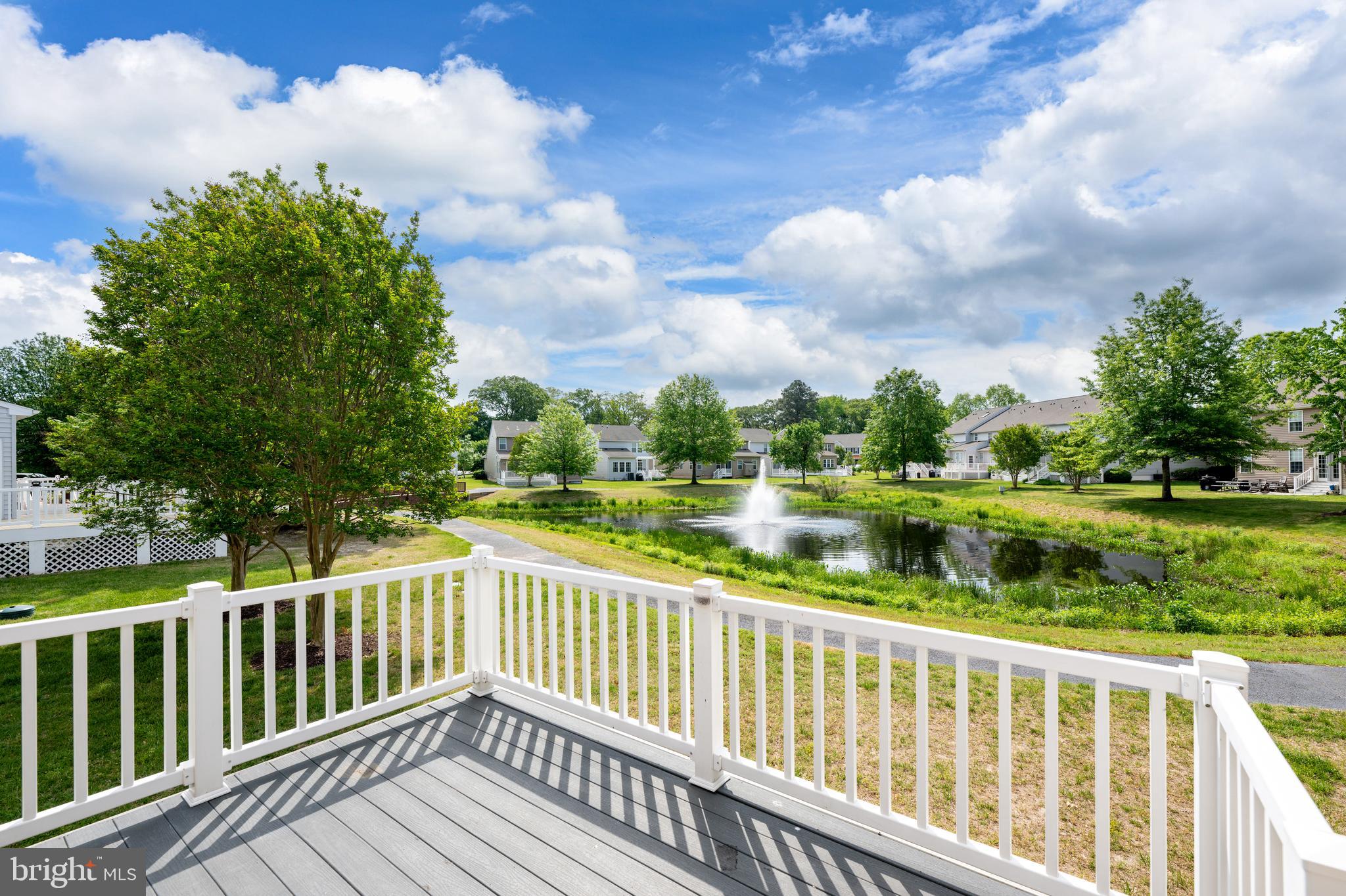 10023 Iron Pointe Drive Extension, Unit 201B2 Millsboro, DE 19966 - Photo 33 of 41 a view of balcony with wooden floor and fence