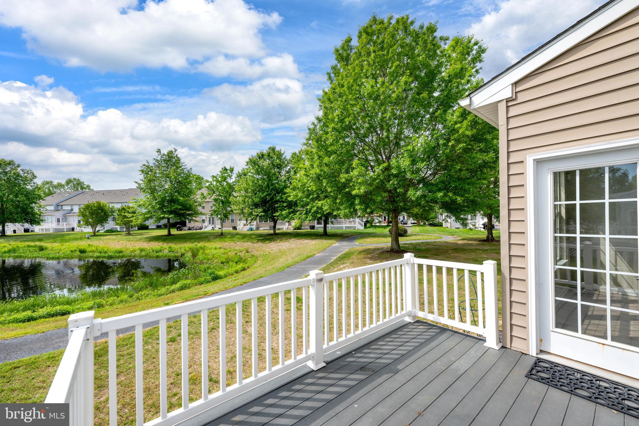 10023 Iron Pointe Drive Extension, Unit 201B2 Millsboro, DE 19966 - Photo 34 of 41 a view of a wooden deck