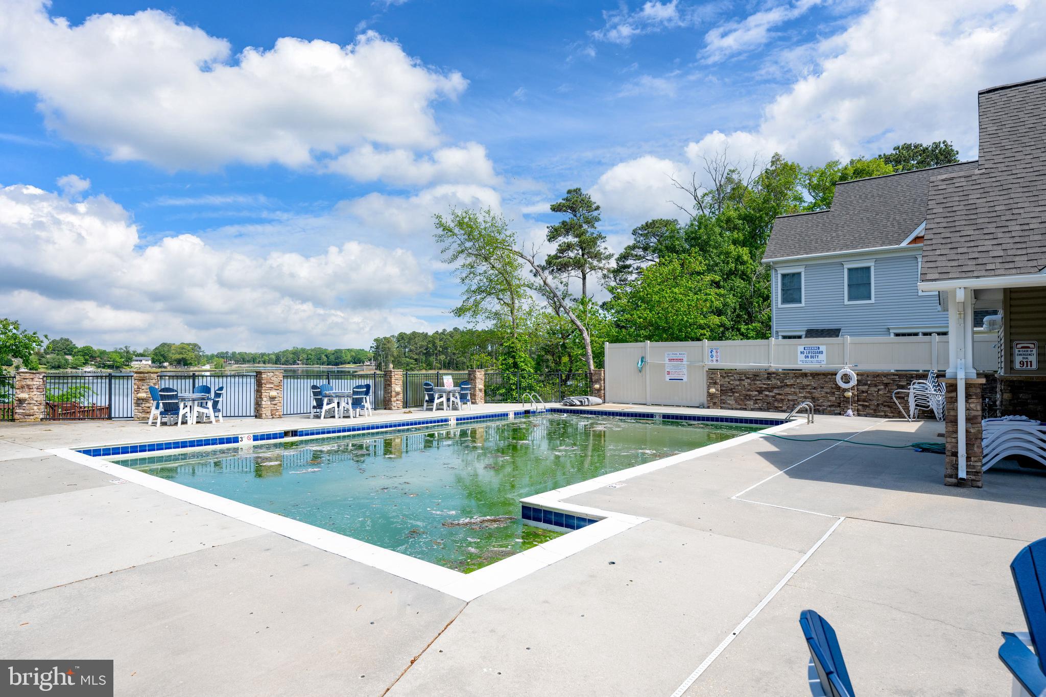 10023 Iron Pointe Drive Extension, Unit 201B2 Millsboro, DE 19966 - Photo 39 of 41 a view of swimming pool from a balcony