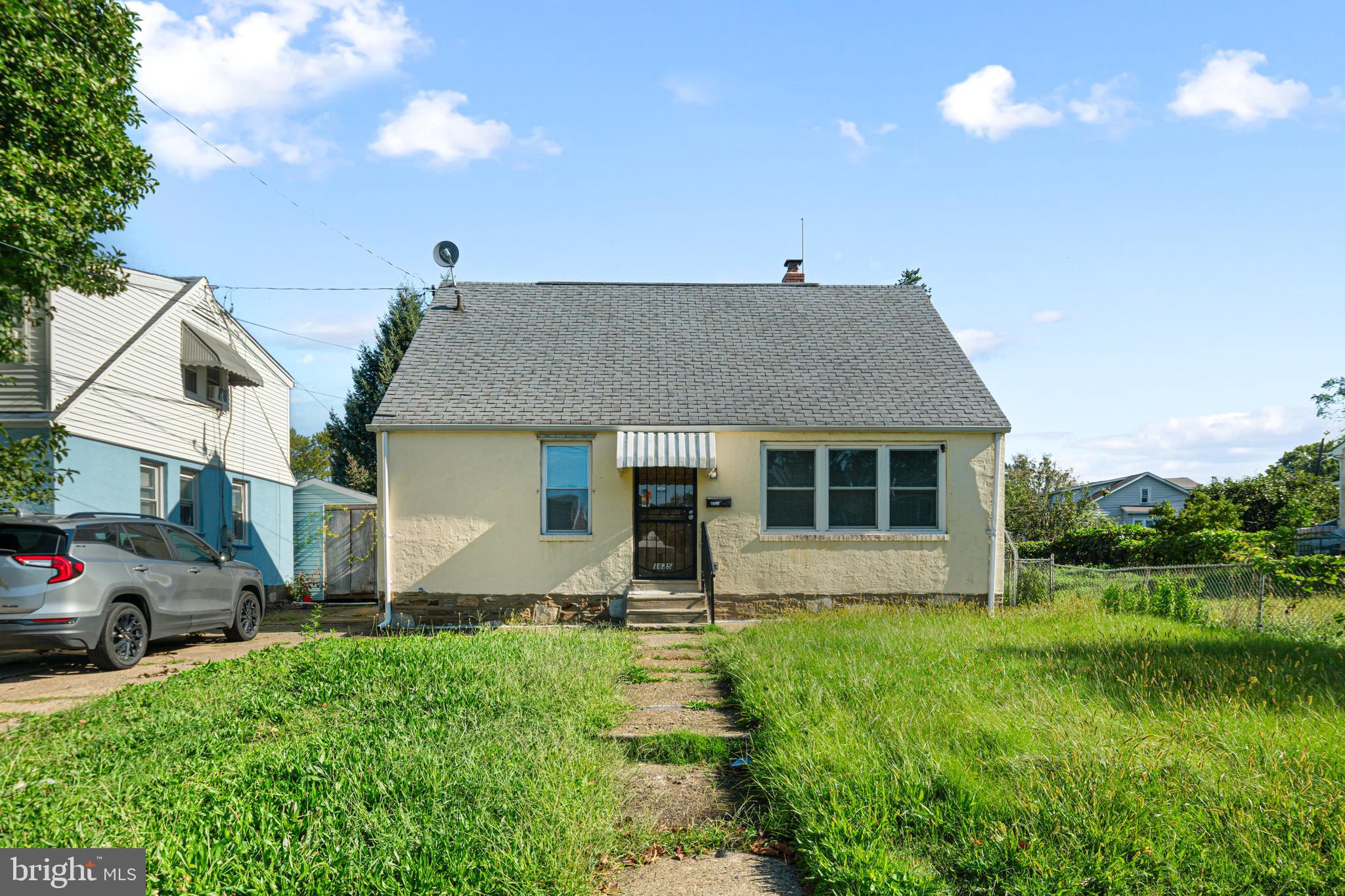 1625 Rhawn Street Philadelphia, PA 19111 - Photo 1 of 15 a front view of a house with garden