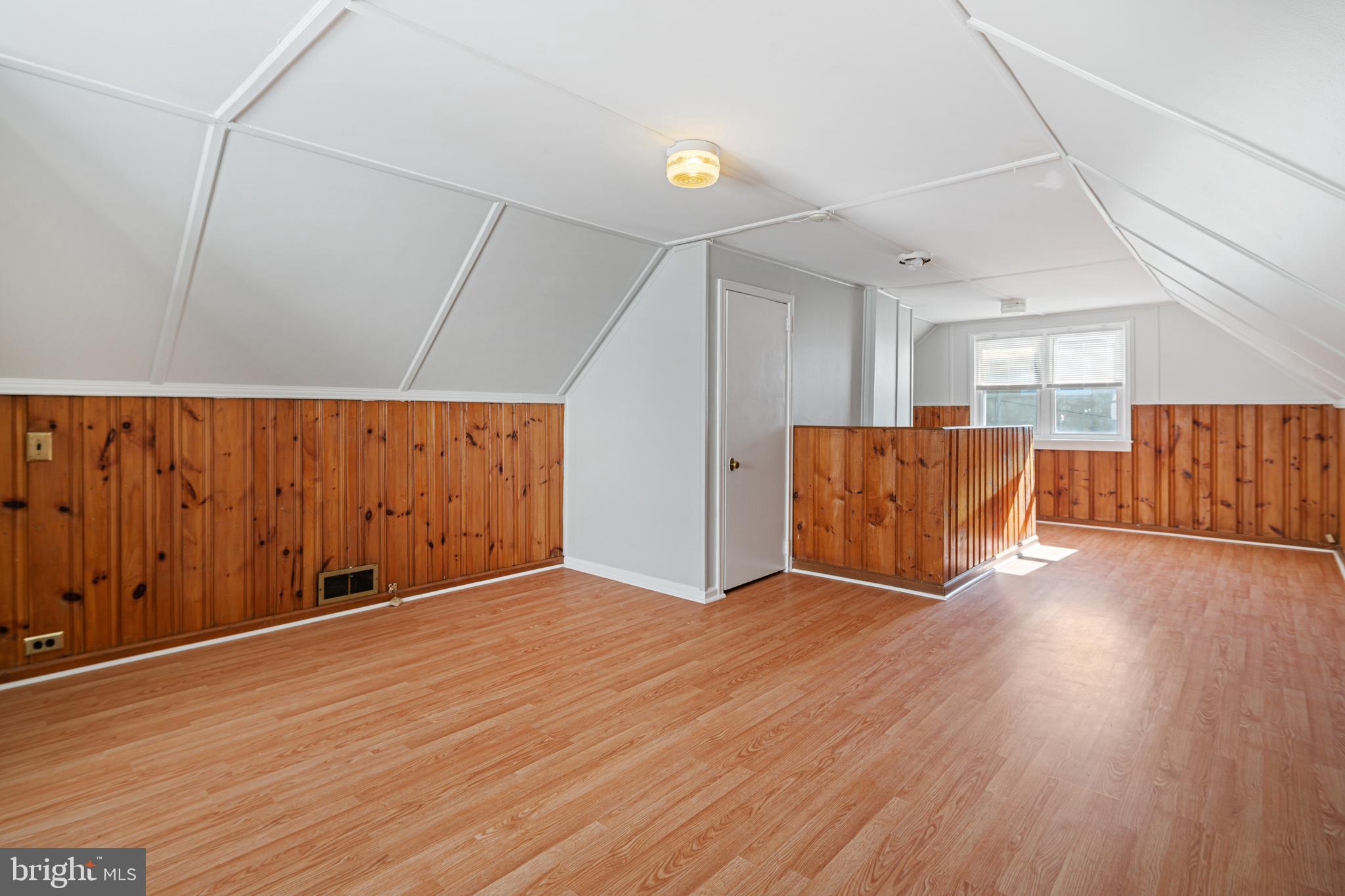 1625 Rhawn Street Philadelphia, PA 19111 - Photo 8 of 15 a view of an empty room with wooden floor