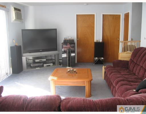 50 Eardley Road Edison, NJ 08817 - Photo 4 of 8 a living room with furniture and a flat screen tv