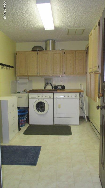 804 Rodeo Court Hawley, PA 18428 - Photo 23 of 37 a kitchen with a stove top oven and cabinets