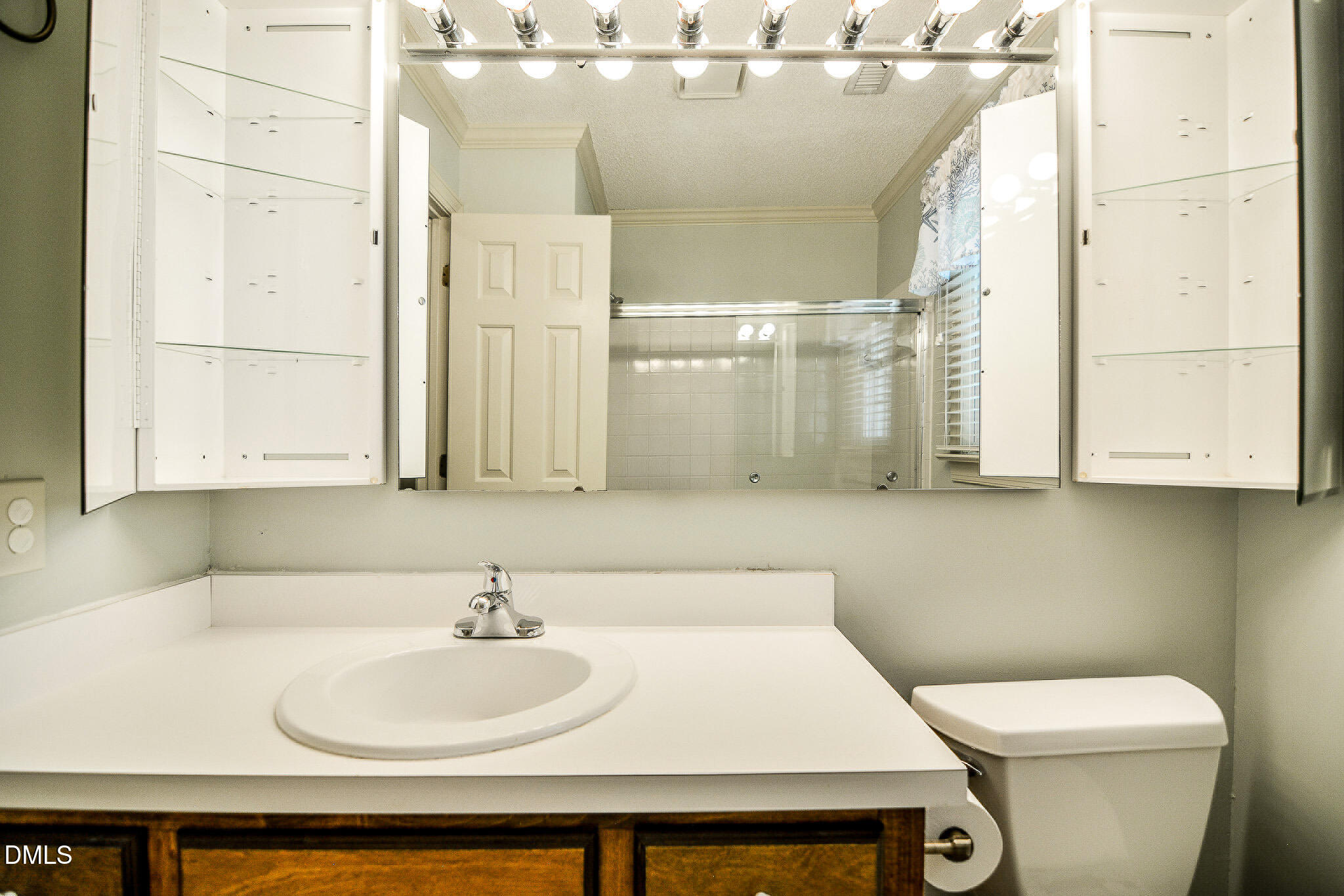 1215 Cambridge Road Northwest Wilson, NC 27896 - Photo 49 of 54 a bathroom with a sink and a toilet