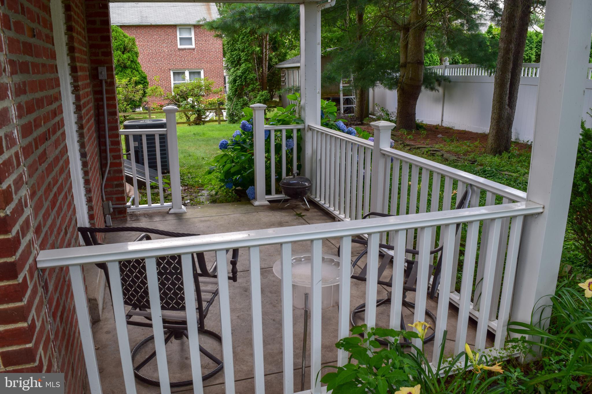 719 Buttonwood Drive Springfield, PA 19064 - Photo 28 of 31 719 Buttonwood Drive side covered patio