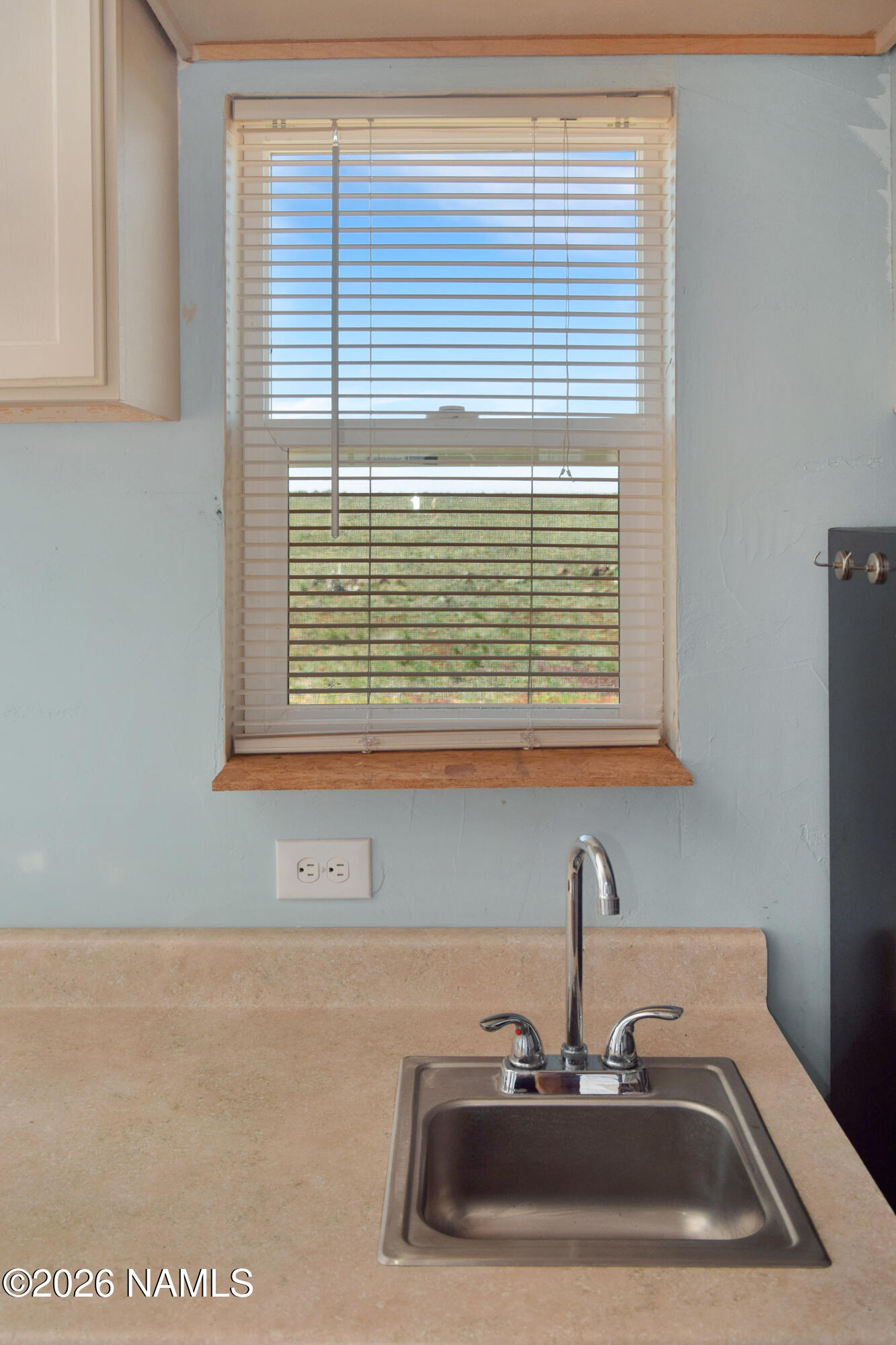 12417 East Tanner Rnch Road Flagstaff, AZ 86005 - Photo 11 of 21 a bathroom with a sink and a window