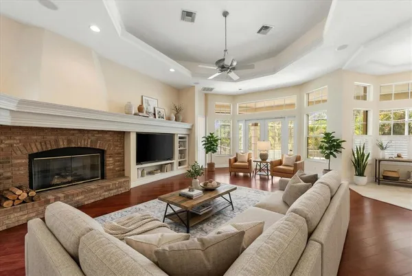 a living room with furniture fireplace and a flat screen tv