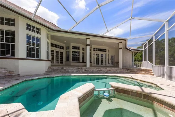a view of a house with backyard sitting area