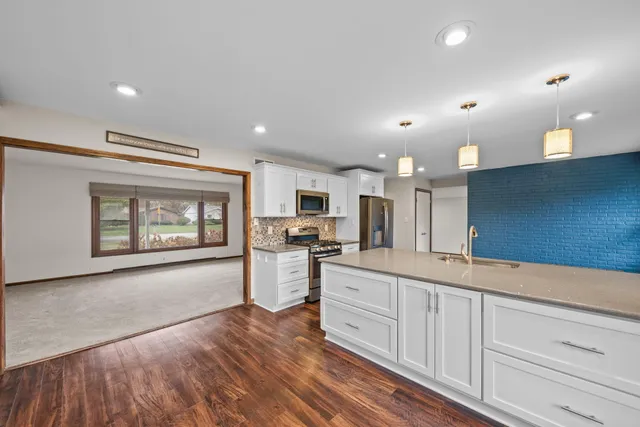 a large kitchen with cabinets