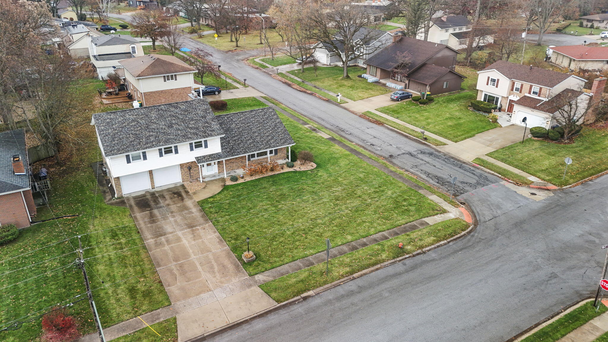 2595 West 65th Avenue Merrillville, IN 46410 - Photo 34 of 36 an aerial view of a residential houses with outdoor space and street view