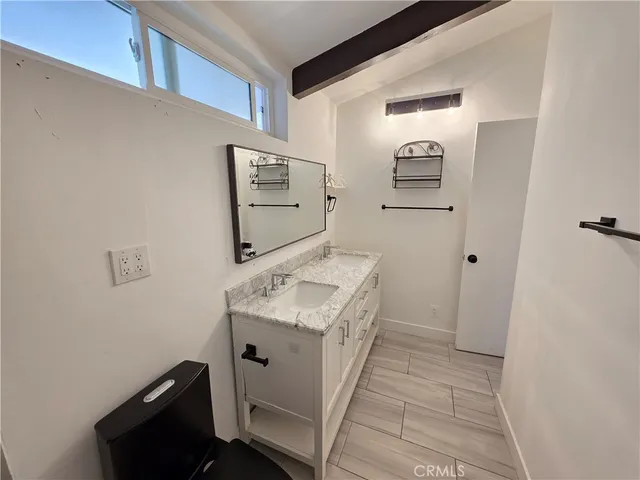 a utility room with cabinets washer and dryer