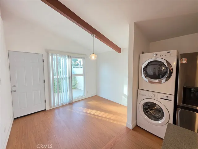 a view of a hallway with washer and dryer