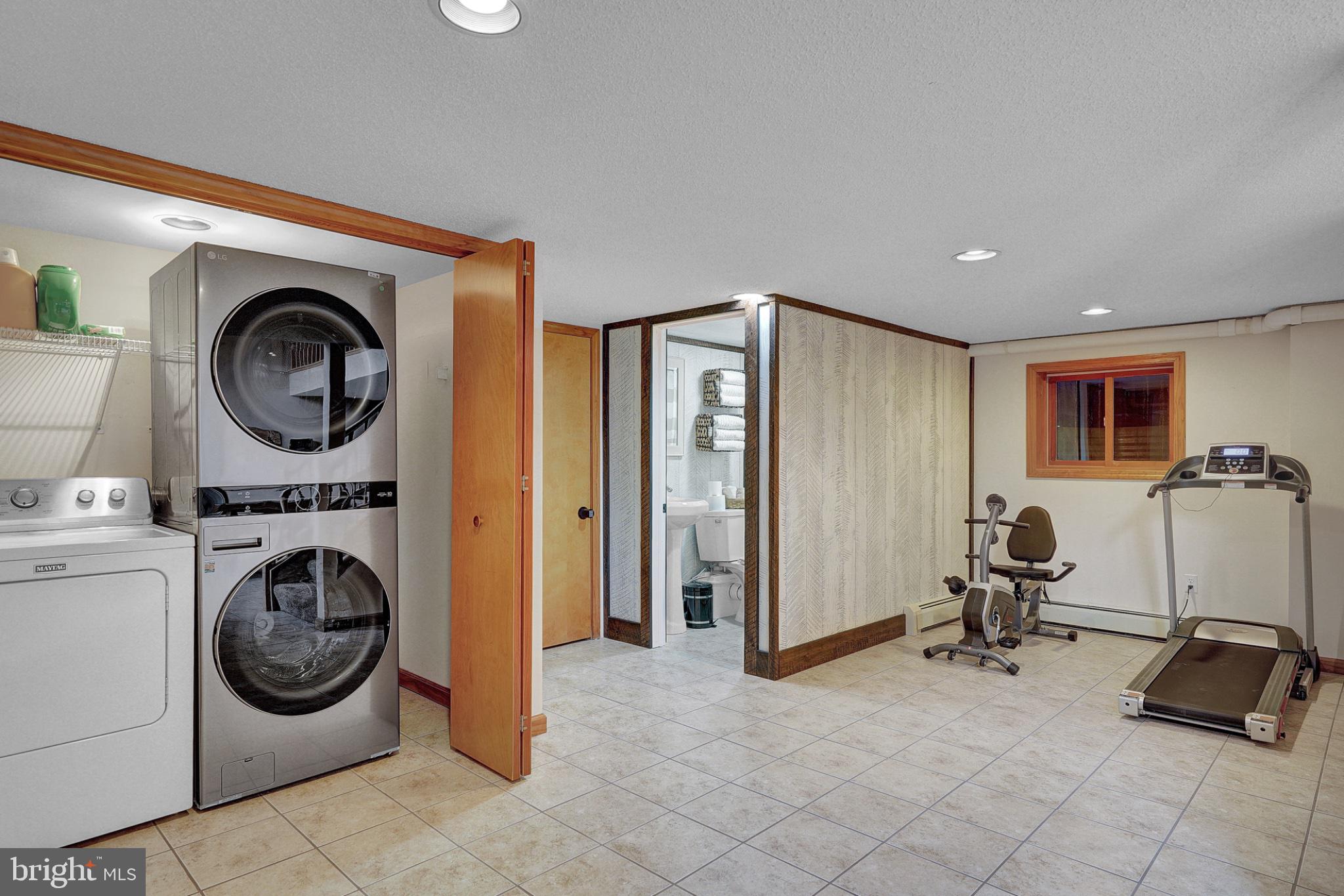 259 A A-Frame Road Coudersport, PA 16915 - Photo 52 of 130 Versatile basement with laundry and fitness.