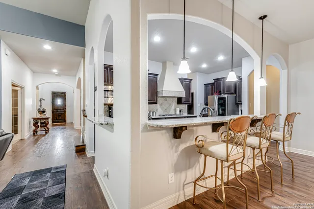 a view of a kitchen and dining room