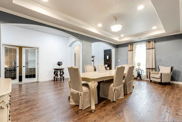 a view of a livingroom with furniture window and wooden floor