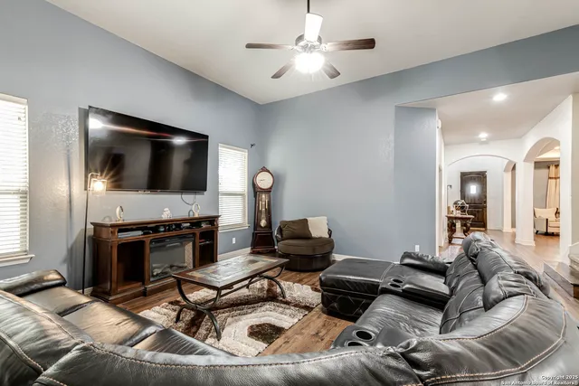 a living room with furniture and a flat screen tv