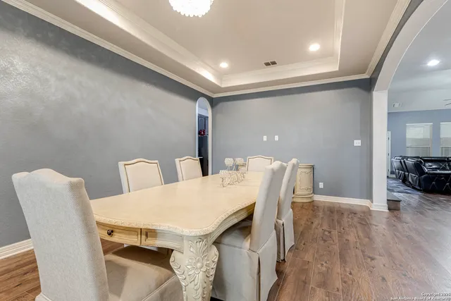 a view of a dining room with furniture and wooden floor