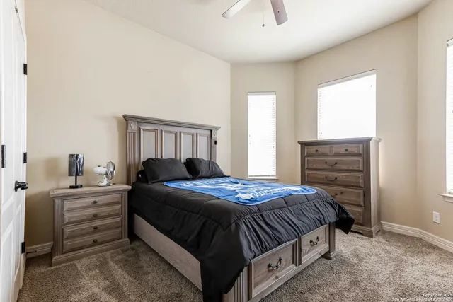 a bedroom with a bed and a dresser