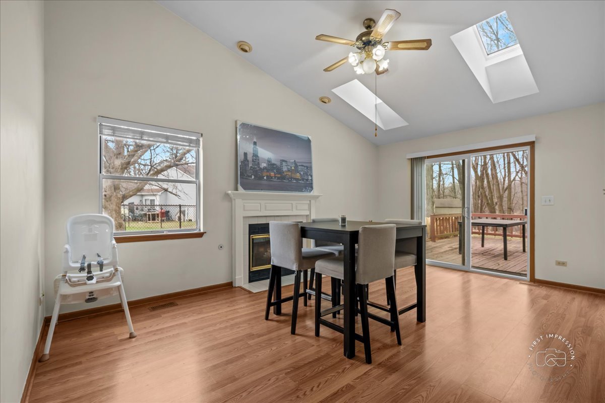 362 Chaparral Court Elgin, IL 60120 - Photo 11 of 15 a view of a dining room with furniture window and wooden floor