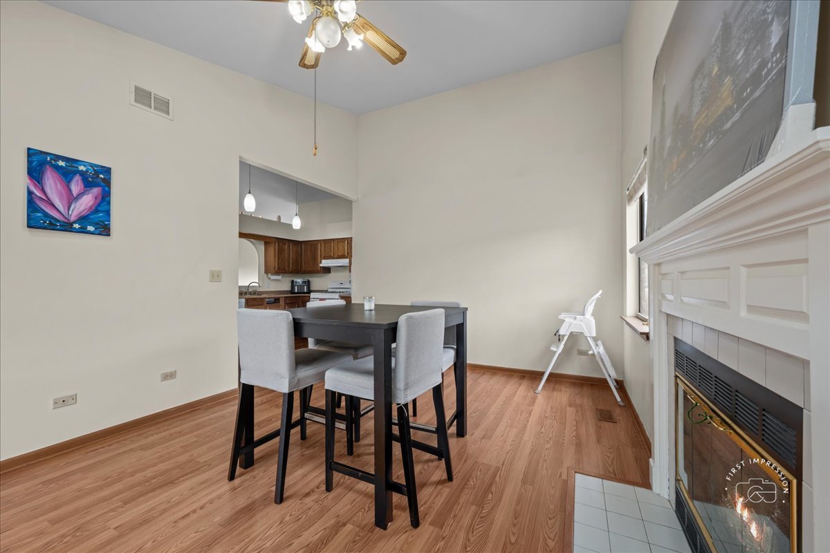 362 Chaparral Court Elgin, IL 60120 - Photo 13 of 15 a view of a dining room with furniture and wooden floor
